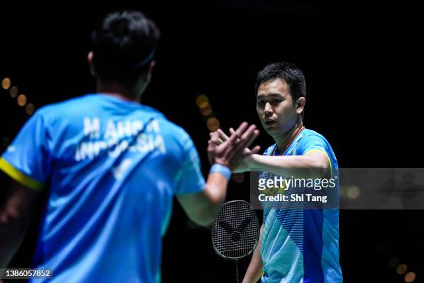 Mohammad Ahsan and Hendra Setiawan of Indonesia react in the Men's Doubles second round match against Liu Cheng and Zhang Nan of China on day two of...