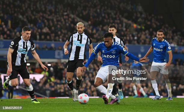 Alex Iwobi of Everton scores their sides first goal during the Premier League match between Everton and Newcastle United at Goodison Park on March...