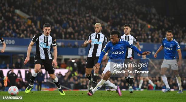 Alex Iwobi of Everton scores their sides first goal during the Premier League match between Everton and Newcastle United at Goodison Park on March...