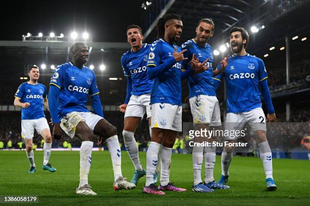 Alex Iwobi of Everton celebrates with team mates after scoring their sides first goal during the Premier League match between Everton and Newcastle...