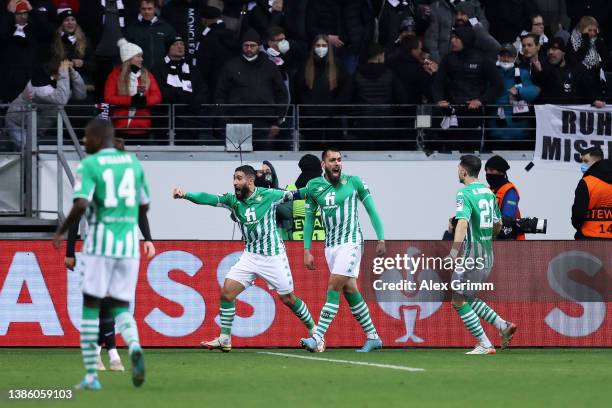 Borja Iglesias of Real Betis celebrates with team mates after scoring their sides first goal during the UEFA Europa League Round of 16 Leg Two match...