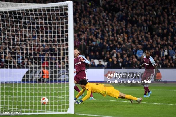 Andriy Yarmolenko of West Ham United scores their team's second goal past Yassine Bounou of Sevilla FC during the UEFA Europa League Round of 16 Leg...