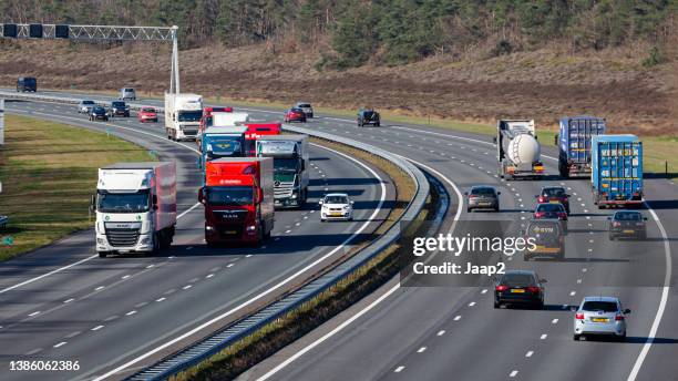 daytime traffic on the a1 highway at rijssen - multiple lane highway stock pictures, royalty-free photos & images