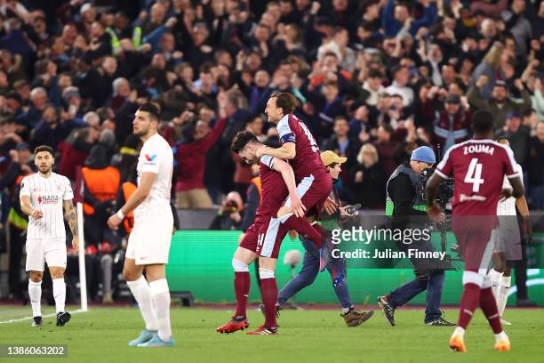 Mark Noble celebrates with Declan Rice of West Ham United after their sides victory during the UEFA Europa League Round of 16 Leg Two match between...
