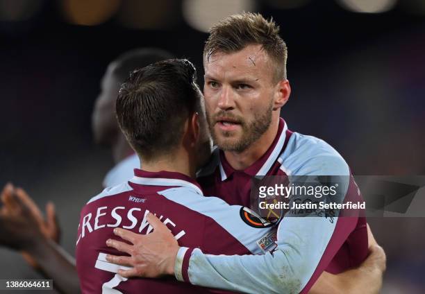Andriy Yarmolenko celebrates with teammate Aaron Cresswell of West Ham United after their sides victory during the UEFA Europa League Round of 16 Leg...