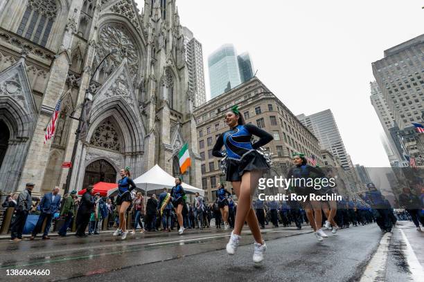Marchers pass by St. Patrick's Cathedral during the 2022 NYC St. Patrick's Day Parade on March 17, 2022 in New York City.