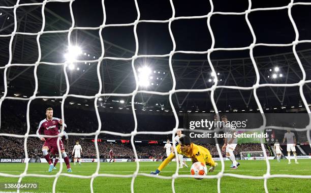 Andriy Yarmolenko of West Ham United scores their team's second goal past Yassine Bounou of Sevilla FC during the UEFA Europa League Round of 16 Leg...
