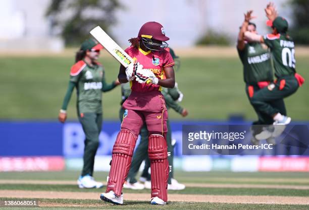Stafanie Taylor of the West Indies looks dejected while leaving the field of play after being dismissed by Nahida Akter of Bangladesh during the 2022...