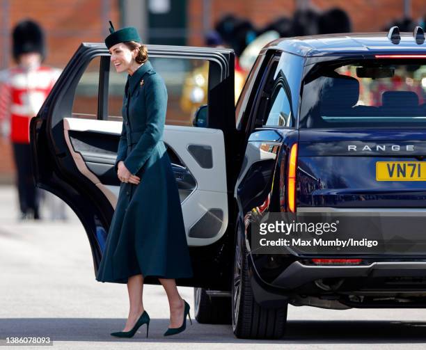 Catherine, Duchess of Cambridge gets out of her Range Rover car as she attends the annual St. Patrick's Day parade at Mons Barracks on March 17, 2022...