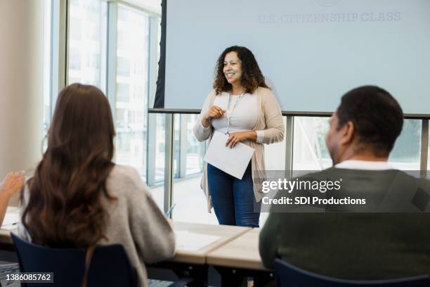 mid adult woman teaches american citizenship class - student government stock pictures, royalty-free photos & images