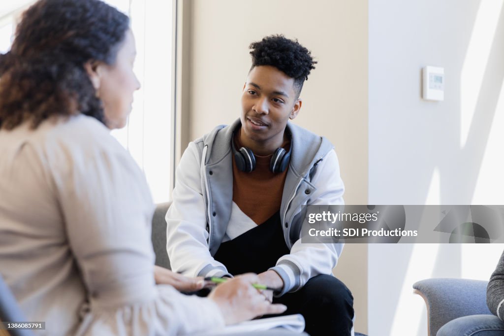 Counselor talks to young man and unseen sister