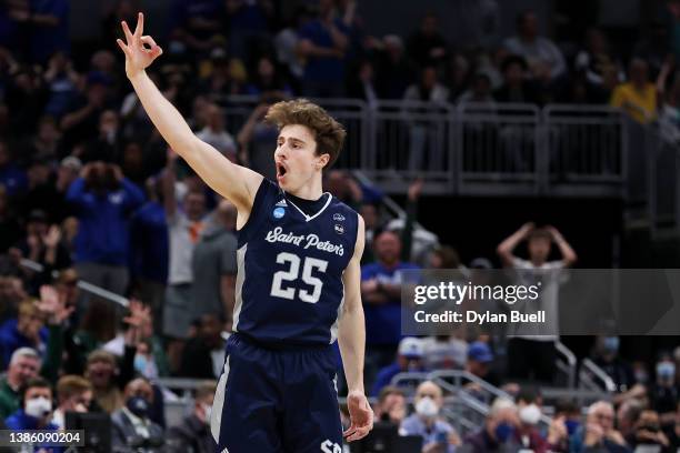 Doug Edert of the Saint Peter's Peacocks celebrates after making a three-point basket against the during the second half in the first round game of...