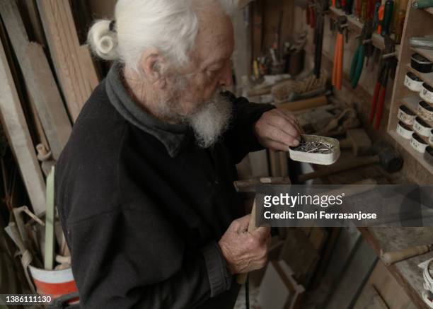 close-up of old man working with carpenter's tools in his workshop - restoring art stock pictures, royalty-free photos & images