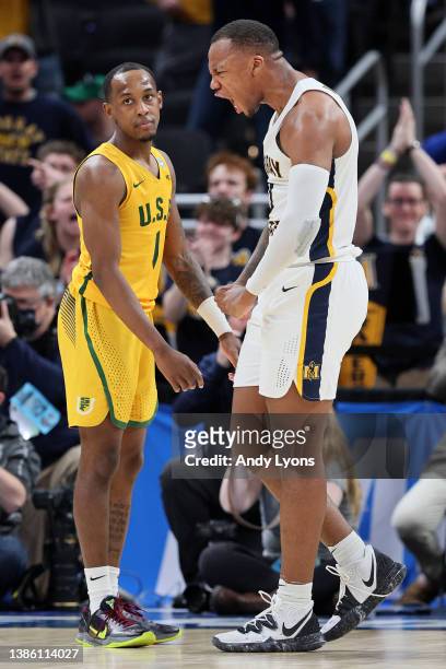 Williams of the Murray State Racers celebrates the 92-87 overtime win as Jamaree Bouyea of the San Francisco Dons reacts in the first round game of...