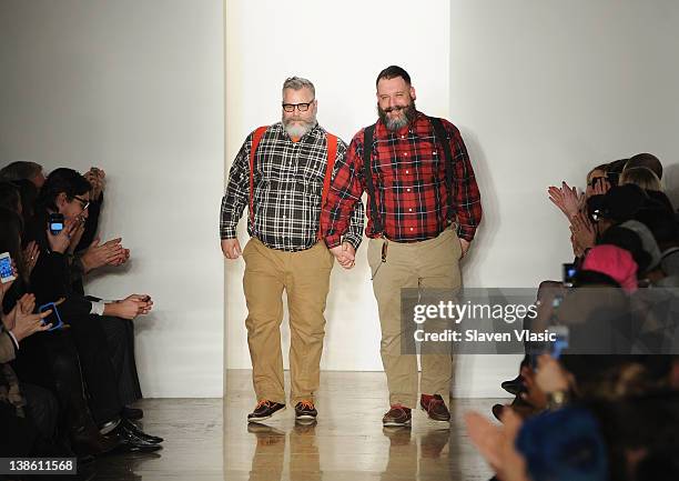 Designers Jeffrey Costello and Robert Tagliapietra walk the runway at the Costello Tagliapiertra fall 2012 fashion show during Mercedes-Benz Fashion...