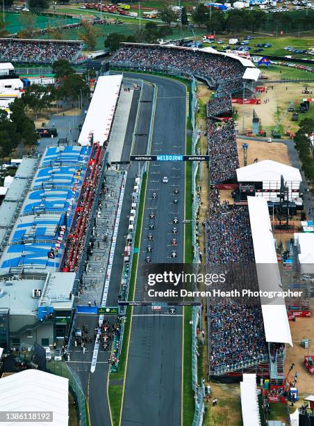 Photographed from an aerial view, British Mercedes-AMG Formula One racing team racing driver Lewis Hamilton sitting in pole position on the start and...