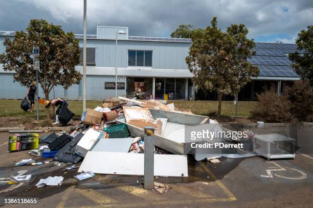 the worst floods in history have devastated the northern rivers city of lismore. the lismore art gallery has debris awaits collection. - flood cleanup stock pictures, royalty-free photos & images