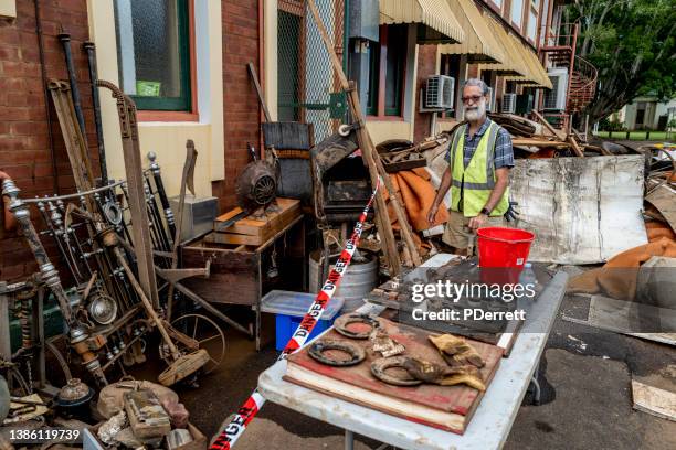 the worst floods in history have devastated the northern rivers city of lismore. debris awaits collection outside the city's iconic museum. - disaster recovery stock pictures, royalty-free photos & images