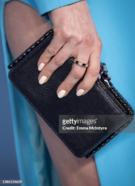 Anne Hathaway, purse detail, attends the global premiere of Apple TV+'s 'WeCrashed' at Academy Museum of Motion Pictures on March 17, 2022 in Los...