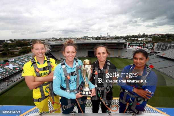 Darcie Brown of Australia, Kate Cross of England, Amelia Kerr of New Zealand and Mithali Raj of India pose on the roof of Eden Park with the ICC...