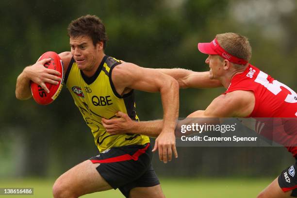 Craig Bird of the Swans is tackled by Ryan O'Keefe of the Swans during a trial match during a Sydney Swans AFL training session at Tramway Oval on...