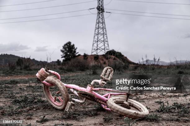 abandoned pink children's bicycle - broken toy stock pictures, royalty-free photos & images
