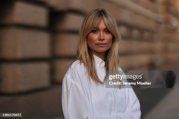 Nadine Berneis wearing a white oversize blouse on March 16, 2022 in Berlin, Germany.