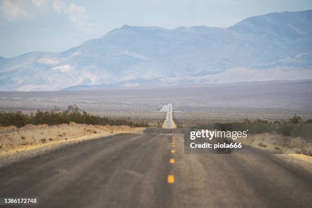 straight roads in death valley national park - desert road stock pictures, royalty-free photos & images