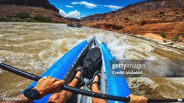 summer travel in the southwest usa: pov rafting with kayak in colorado river - moab rafting stock pictures, royalty-free photos & images