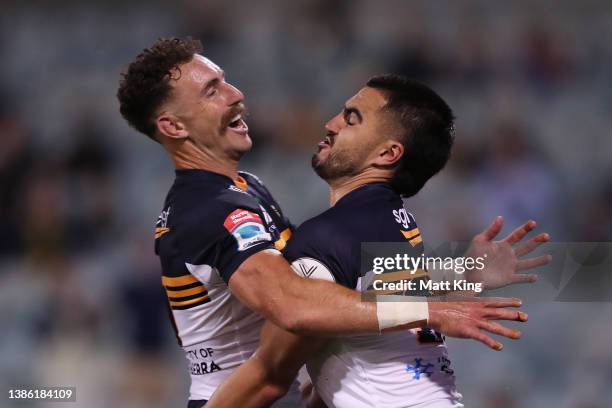 Tom Wright of the Brumbies celebrates with Nic White after scoring a try during the round five Super Rugby Pacific match between the ACT Brumbies and...
