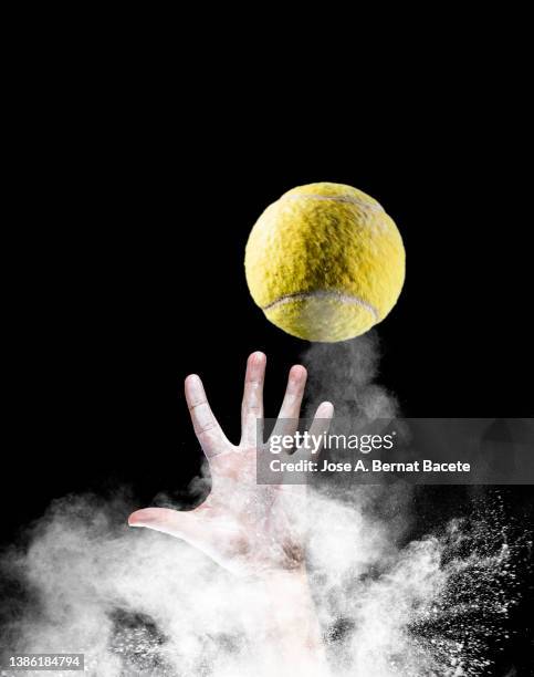 hands of a tennis player catching a ball. - ballon rebond stock pictures, royalty-free photos & images