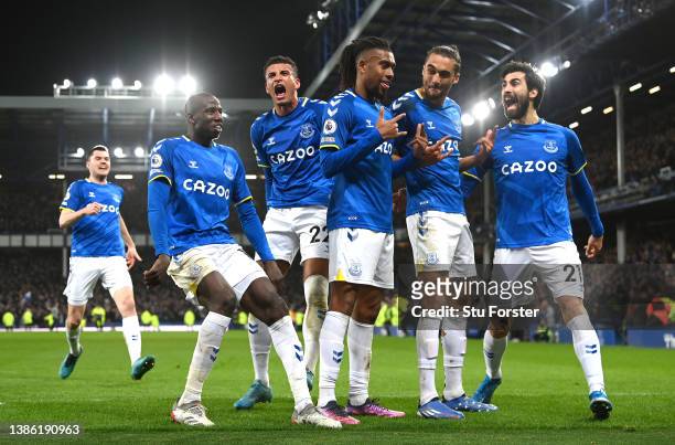 Everton striker Alex Iwobi celebrates with team mates after scoring the winning goal during the Premier League match between Everton and Newcastle...