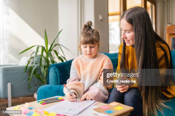 little girl studying and learning at home. homeschooling concept - encouragement letter stock pictures, royalty-free photos & images