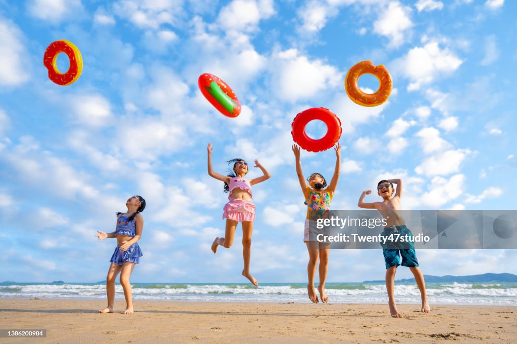 Playful children playing on the beach
