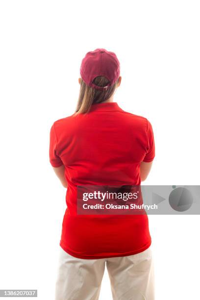 back view of woman in red t-shirt polo - red polo stock pictures, royalty-free photos & images