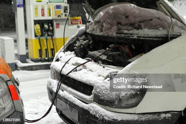 van being jump started by rescue vehicle - vehicle breakdown stock pictures, royalty-free photos & images