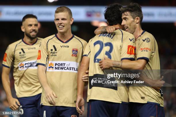 Eli Babalj of the Jets celebrates his goal with Jason Hoffman and Jordan Elsey and Matthew Jurman during the A-League Mens match between Newcastle...