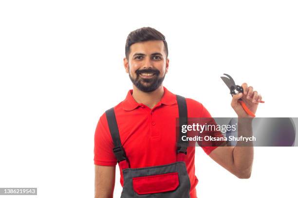 gardener in red polo isolated on white - gartenhandschuh freisteller stock-fotos und bilder