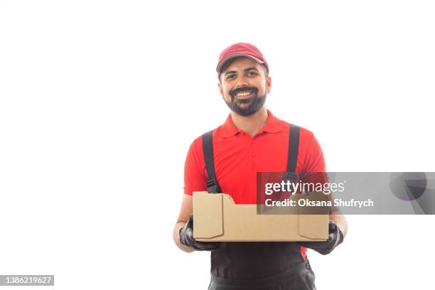 dalivery worker holds cardboard box - delivery person on white stock pictures, royalty-free photos & images