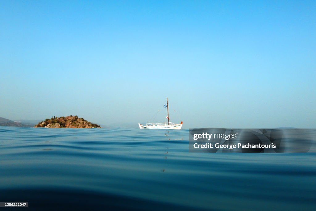 Greek traditional fishing boat at sea in the summer