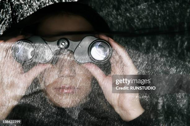 woman with binoculars,fabric - surveillance stockfoto's en -beelden