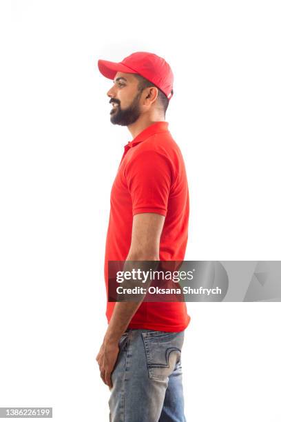 man in red t-shirt polo with free space for design - rode spijkerbroek stockfoto's en -beelden