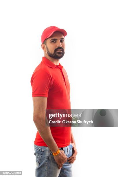 man in red t-shirt polo with free space for design - indian male model stockfoto's en -beelden