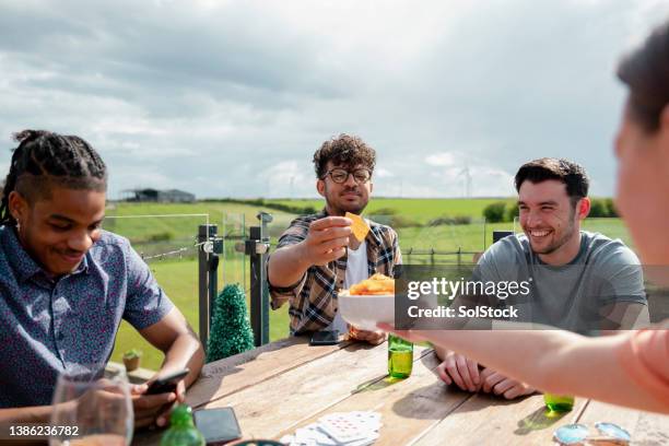 enjoying snacks - crisps stock pictures, royalty-free photos & images