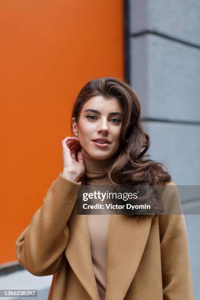 portrait of gorgeous young lady with beautiful long hair. - fashion orange colour stock pictures, royalty-free photos & images