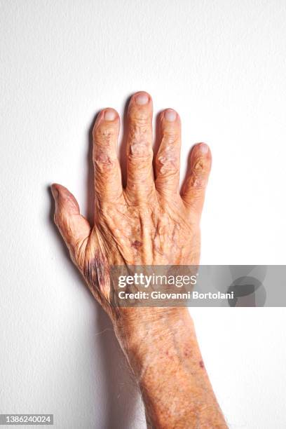 hand of a hundred-year-old man - hand top view isolated stock pictures, royalty-free photos & images