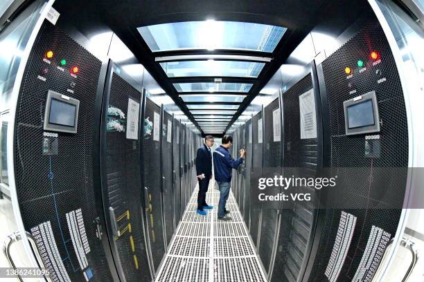 Staff members inspect computer hardware at Gannan Data Lake with a total storage capacity of 150PB on March 17, 2022 in Ganzhou, Jiangxi Province of...