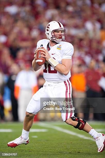 Quarterback Andrew Luck of the Stanford Cardinal drops back to pass during the game against the Oklahoma State Cowboys during the Tostitos Fiesta...