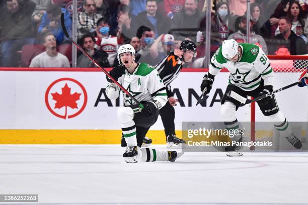 John Klingberg of the Dallas Stars reacts as he celebrates his overtime goal against the Montreal Canadiens at Centre Bell on March 17, 2022 in...