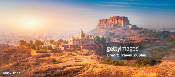 jodhpur, rajasthan, india- sunrise at the mehrangarh fort and jaswant thada mausoleum with the blue city in the background - monument india stock pictures, royalty-free photos & images